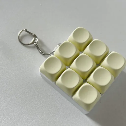 2-Pack Light Yellow Mechanical 9-Keyboard Fingertip Toy Keychain - Key Pressure Relief, PVC Fingertip Toy