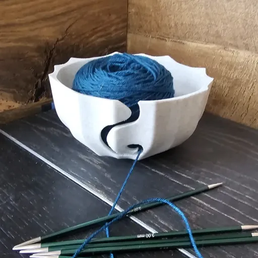 A 3D-printed yarn bowl to accompany your knitting and crochet time. White.
