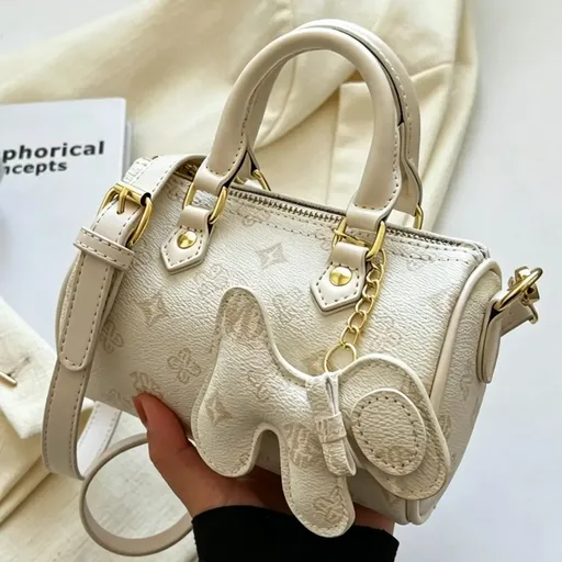 Classic Monogram Pillow Bag: Premium PU Leather with Luxe Feel, Cute Pet Charm for a Playful Touch, Compact Size Fits Phone, Multiple Carry Ways, Versatile for Commute & Dates./WHITE